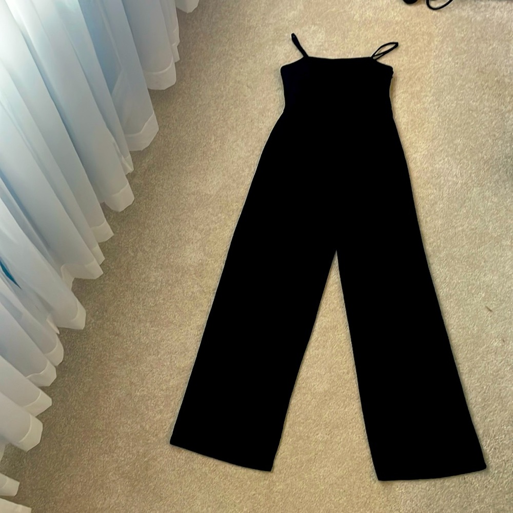 Thin strapped black jumpsuit. Excellent condition.